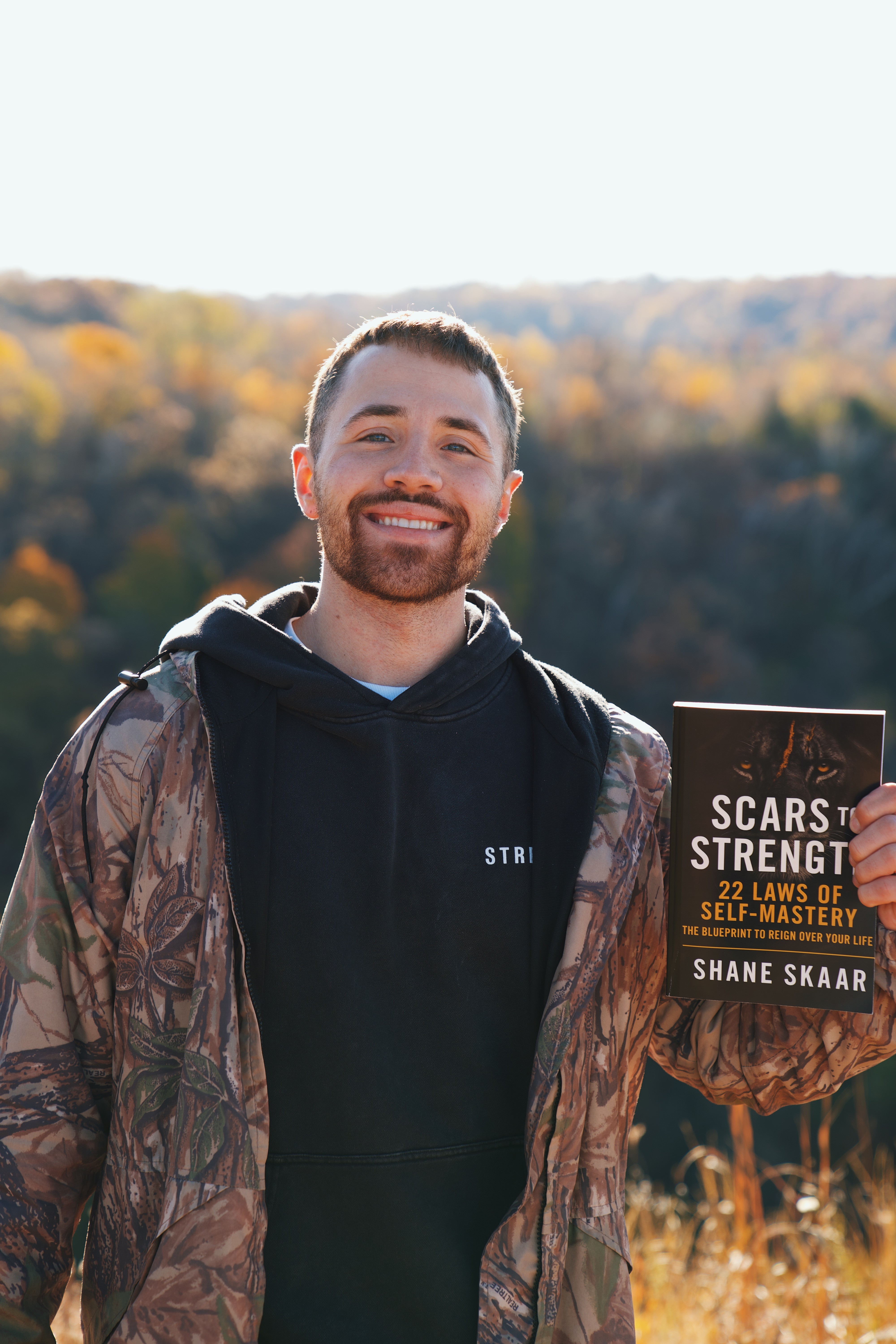 Shane Skaar holding Scars to Strength